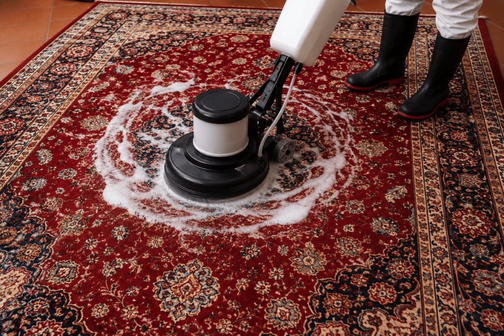a professional rug cleaner washing a persian rug